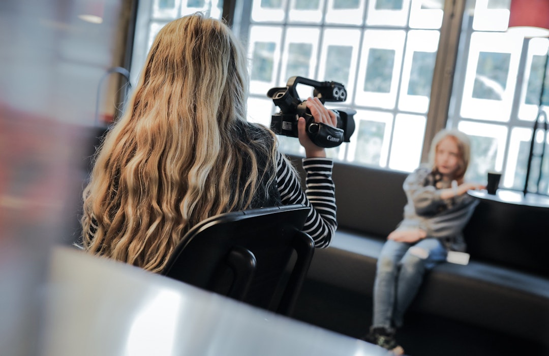 One child filming another one during a workshop.