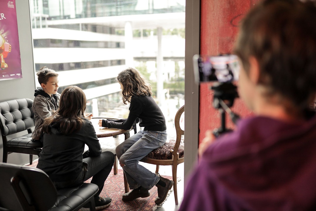 One child filming another one during a workshop.